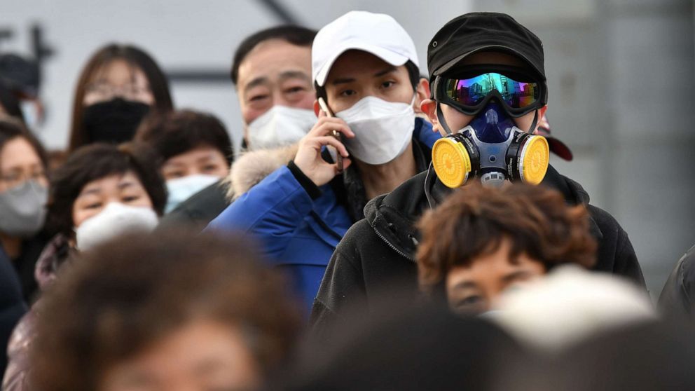 PHOTO: A man wears a mask and goggles as he waits in line to buy face masks from a post office in Daegu, South Korea, Feb. 27, 2020. 