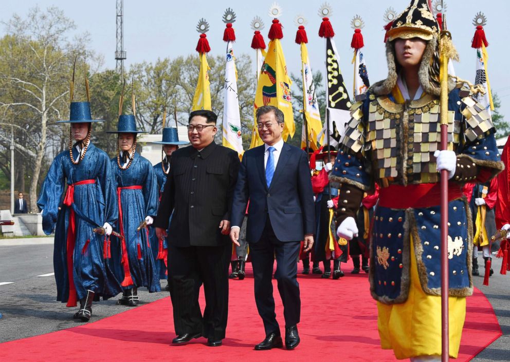 PHOTO: North Korean leader Kim Jong Un and South Korean President Moon Jae-in walk together at the border village of Panmunjom in the Demilitarized Zone, April 27, 2018.