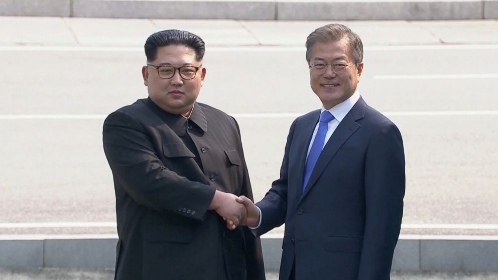 PHOTO: North Korean leader Kim Jong Un shakes hands with South Korean President Moon Jae-in as both of them arrive for the inter-Korean summit at the truce village of Panmunjom, April 27, 2018. 