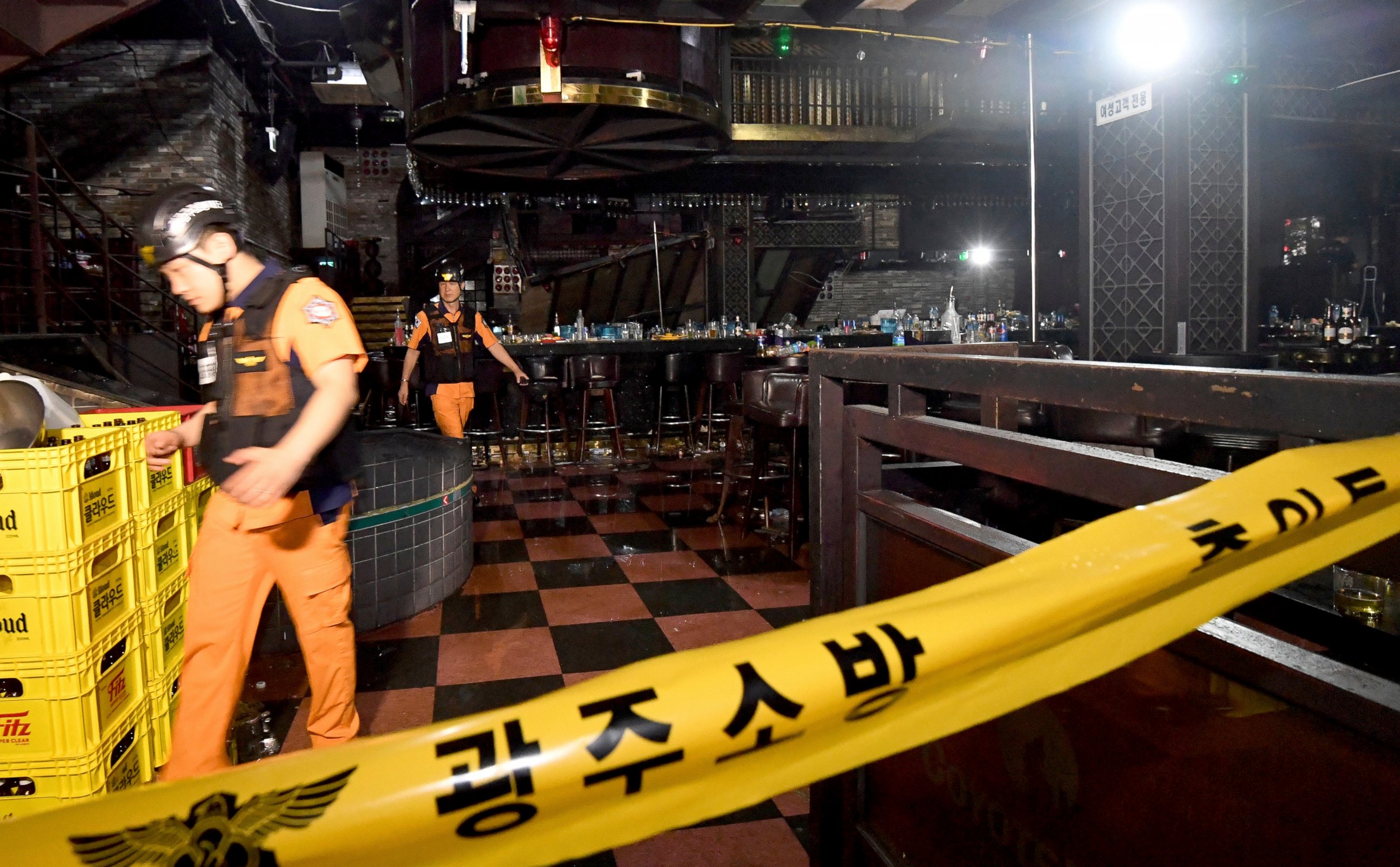 PHOTO: Rescue workers walk to inspect a collapsed internal balcony at a nightclub in Gwangju, South Korea, Saturday, July 27, 2019.