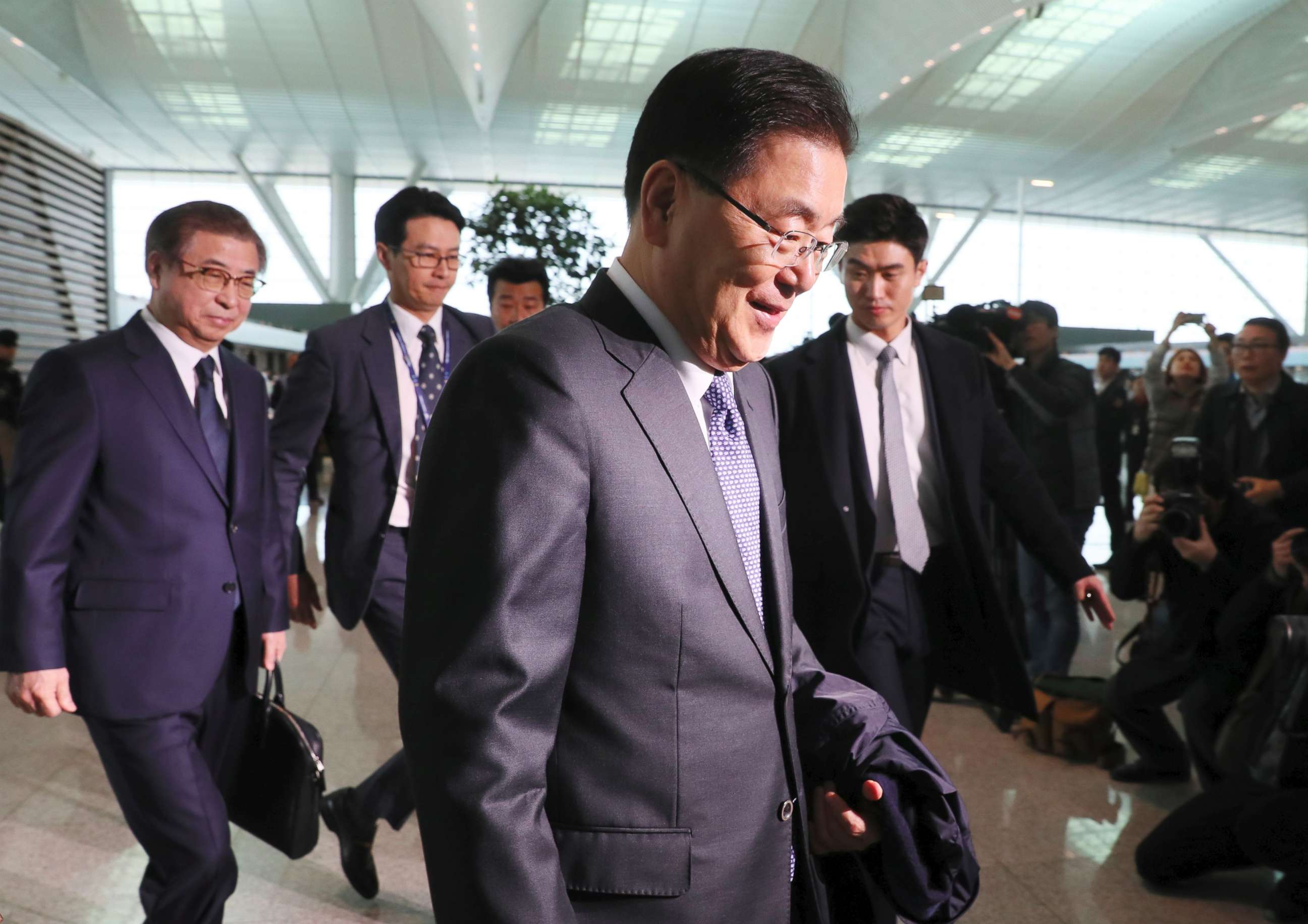 PHOTO: South Korea's national security advisor Chung Eui-yong and spy chief Suh Hoon arrive at Incheon airport, west of Seoul, on March 8, 2018 to leave for Washington.