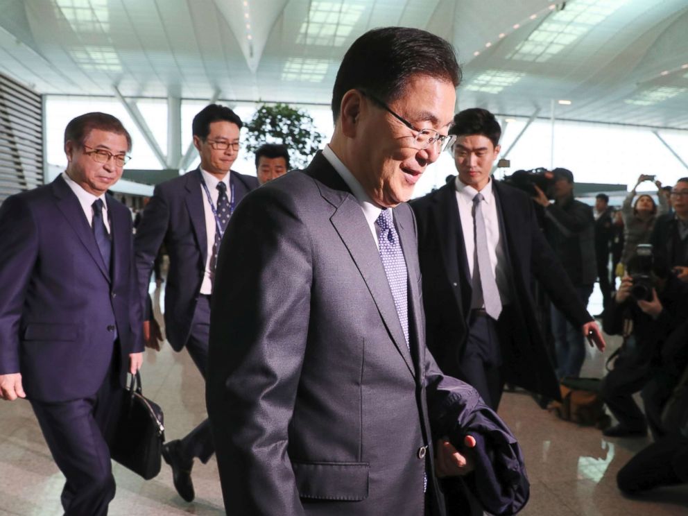 PHOTO: South Koreas national security advisor Chung Eui-yong and spy chief Suh Hoon arrive at Incheon airport, west of Seoul, on March 8, 2018 to leave for Washington.