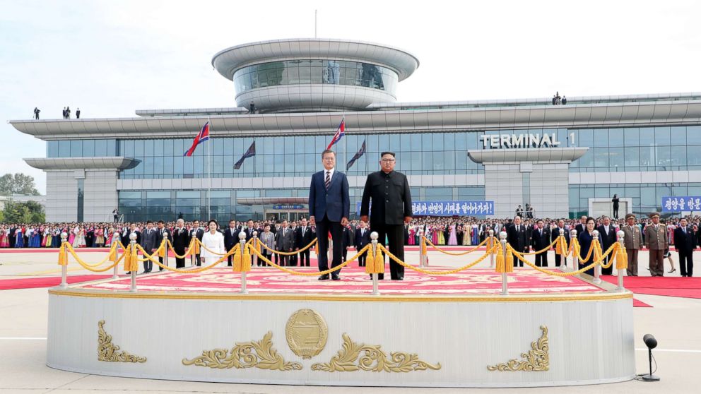 PHOTO: South Korean president Moon Jae-in and North Korean leader Kim Jong Un stand facing the honor guards ceremony at Sunan International Airport, Pyongyang North Korea. Sep 18, 2018. 