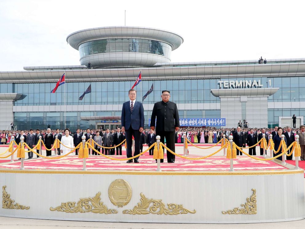 PHOTO: South Korean president Moon Jae-in and North Korean leader Kim Jong Un stand facing the honor guards ceremony at Sunan International Airport, Pyongyang North Korea. Sep 18, 2018.