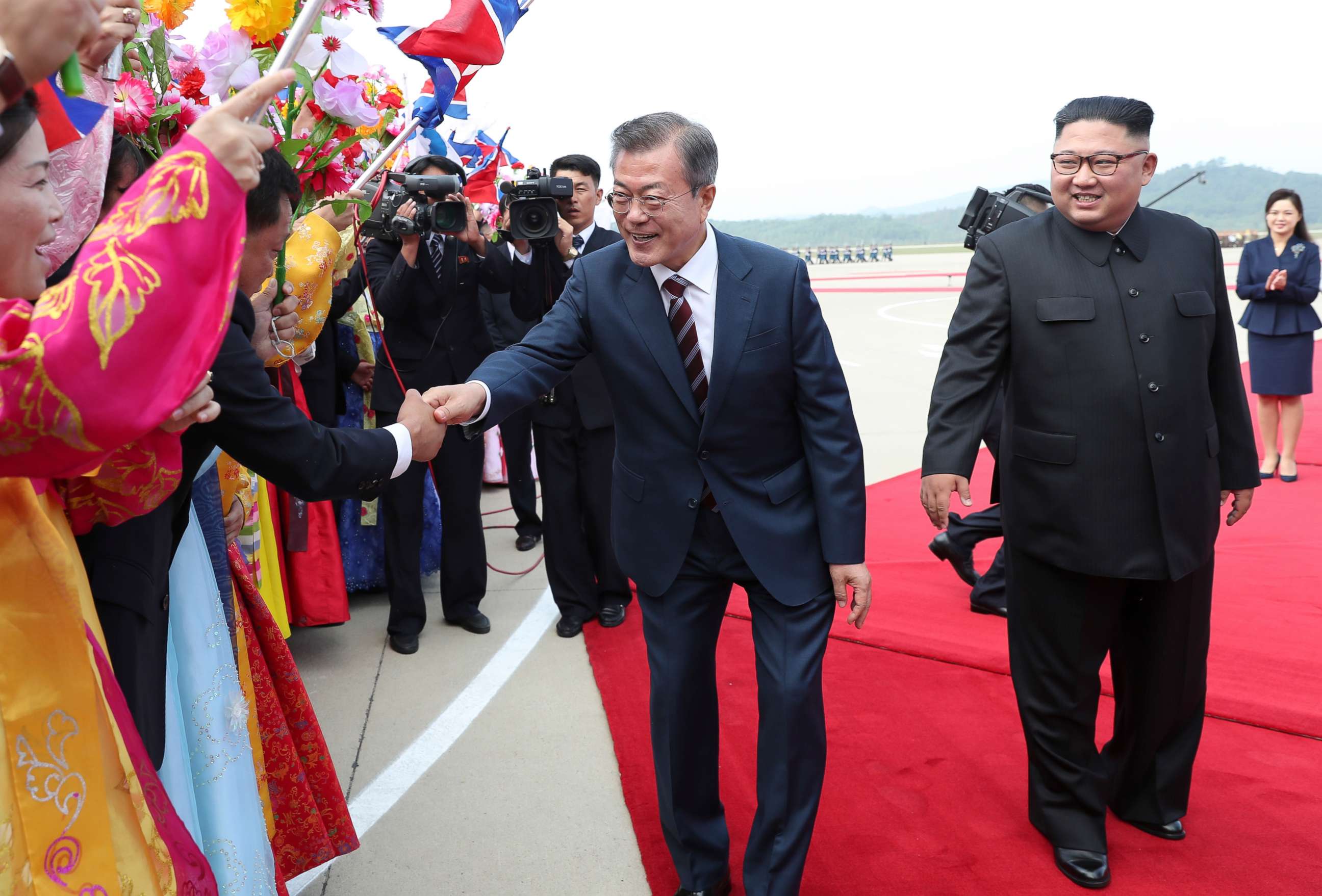 South Korean president Moon Jae-in and North Korean leader Kim Jong Un greet North Korean citizens at Sunan International Airport, Pyongyang North Korea. Sep 18, 2018. 