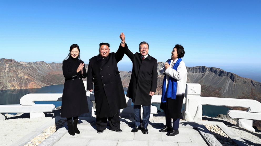South Korean President Moon Jae-in, second from right, and his wife Kim Jung-sook, right, stand with North Korean leader Kim Jong Un, second from left, and his wife Ri Sol Ju on the Mount Paektu in North Korea, Thursday, Sept. 20, 2018.