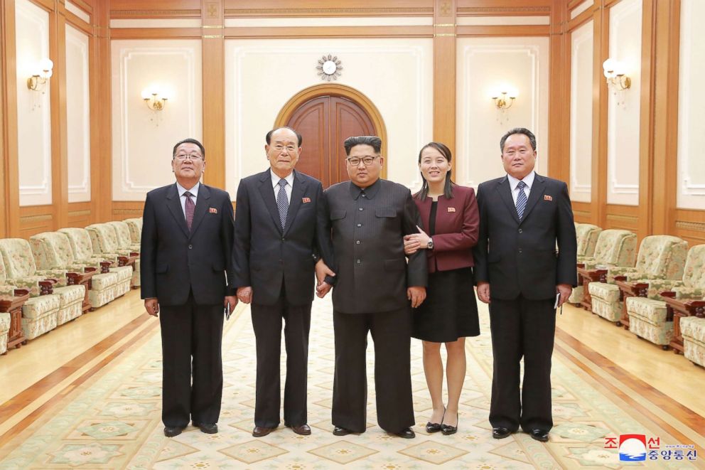 PHOTO: In a handout photograph released by the North Korean News Agency, North Korea's Kim Jong-un, center is shown with members of the high-level delegation, including his sister, Kim Yo-jong, who visited South Korea to attend  the 2018 Winter Olympics.