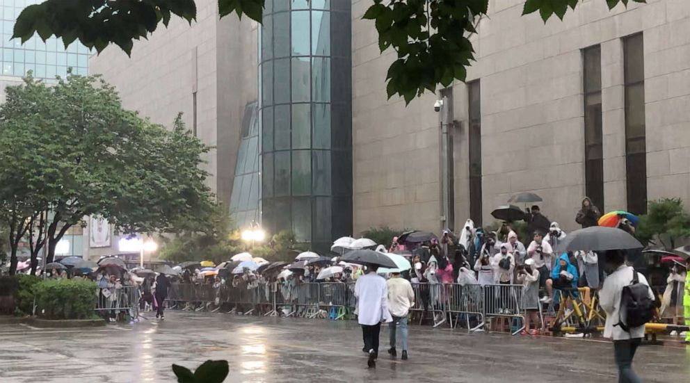 PHOTO: Passionate K-pop admirers stake out to take pictures of their favorite K-pop star in front of the broadcast station in Seoul, South Korea.
