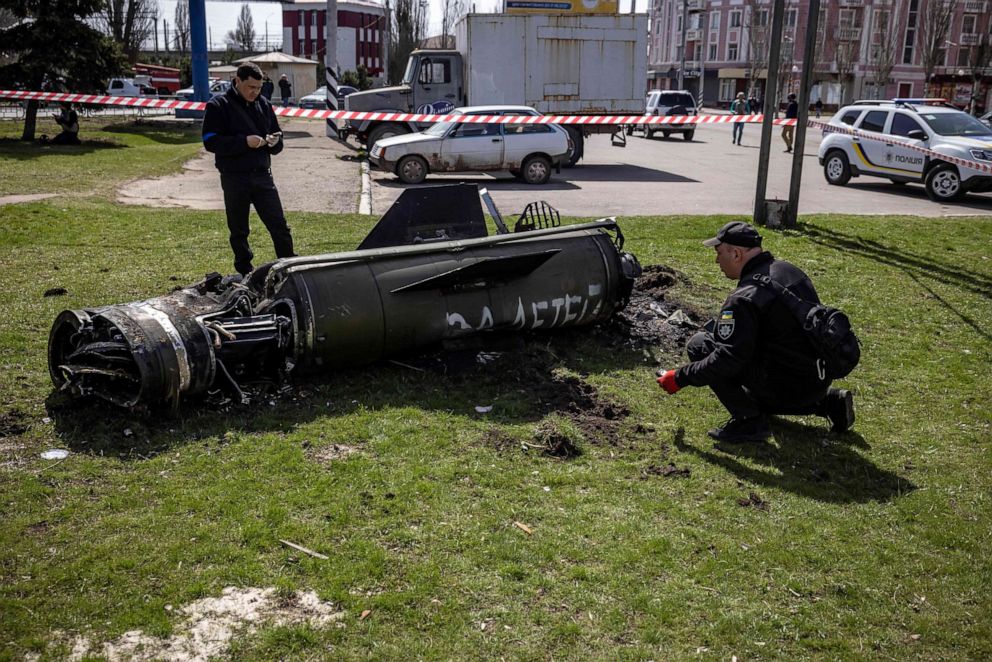 PHOTO: Police inspect the remains of a large rocket with the words "for our children" in Russian next to the train station, being used for civilian evacuations, in Kramatorsk, Ukraine, which was hit by a rocket attack killing many people on April 8, 2022.