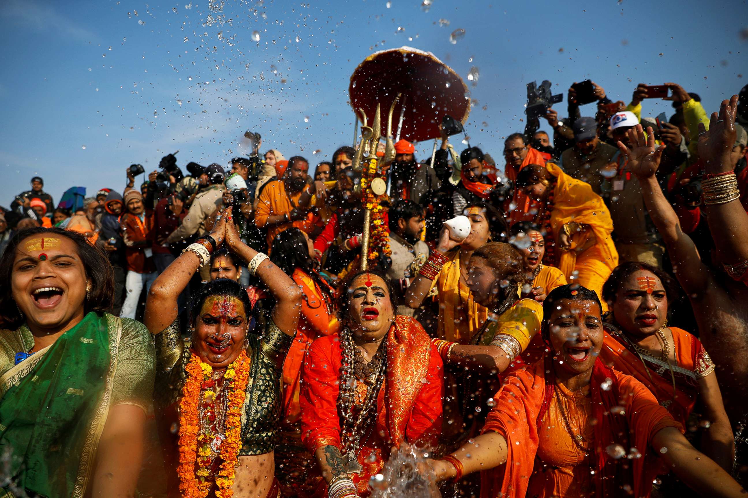 Lakshmi Narayan Tripathi, chief of the "Kinnar Akhada" congregation for transgender people and other members take a dip during the first "Shahi Snan" at "Kumbh Mela" or the Pitcher Festival, in India, Jan. 15, 2019.