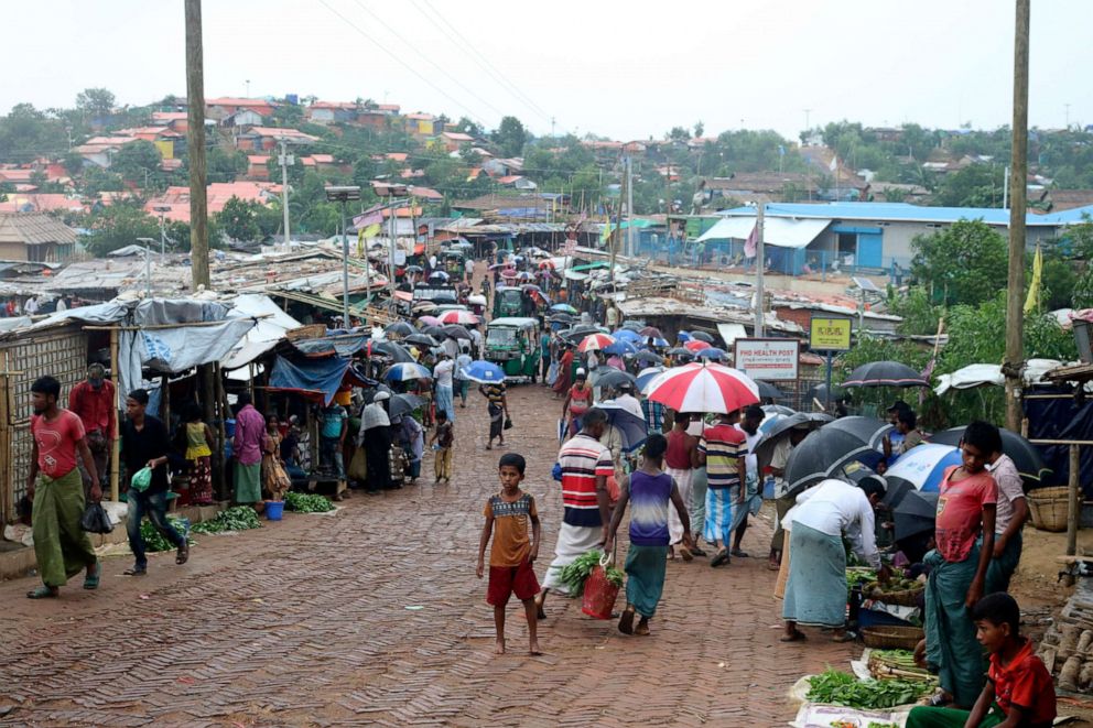 PHOTO: People shop for vegetables at the Kutupalong refugee camp in Ukhia in Cox's Bazar District, Bangladesh, on June 2, 2020.