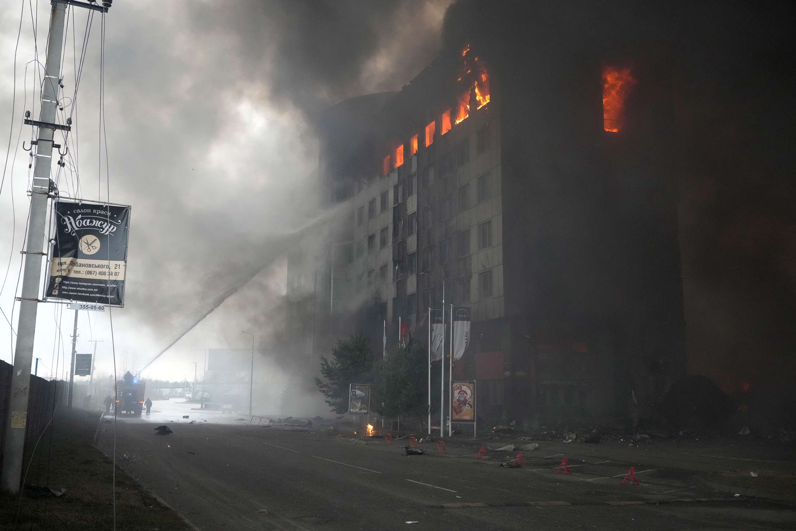 PHOTO: Firefighters hose down a burning building after bombing in Kyiv, Ukraine, March 3, 2022.