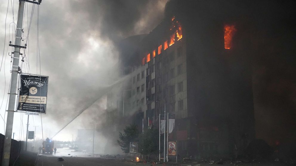 PHOTO: Firefighters hose down a burning building after bombing in Kyiv, Ukraine, March 3, 2022.