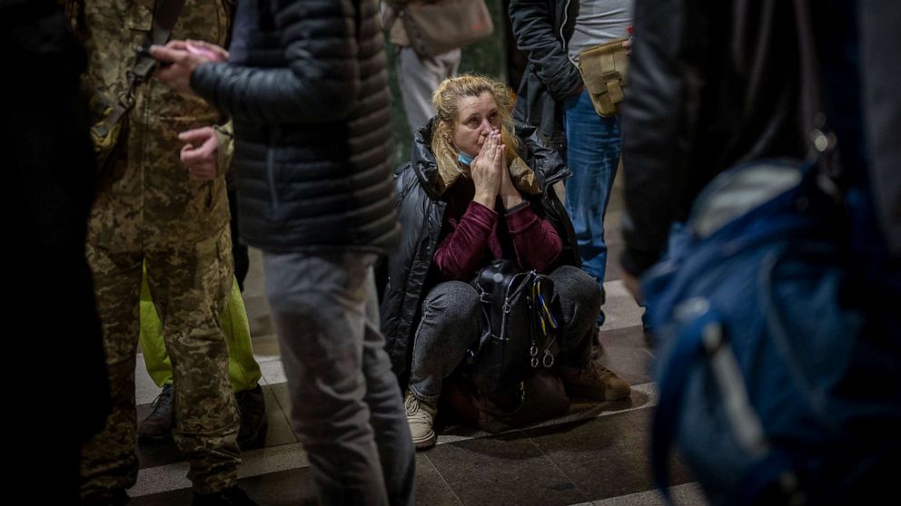 PHOTO: A woman reacts as she waits for a train trying to leave Kyiv, Ukraine, Feb. 24, 2022.