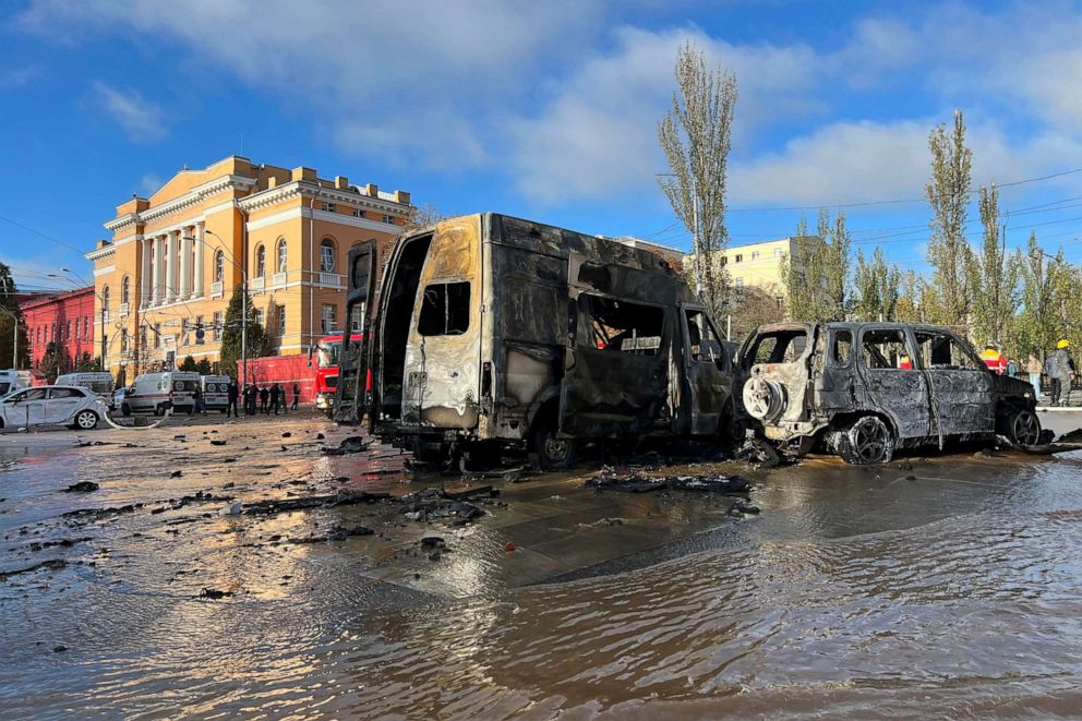 PHOTO: Cars sit damaged as underground pipes leak at the scene of a Russian attack on Kyiv, Ukraine, on Oct. 10, 2022. 