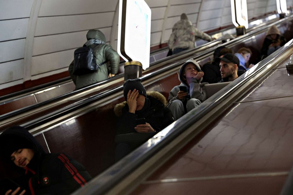 PHOTO: People take shelter inside the metro station amid Russian missile attacks in Kyiv, Ukraine, December 5, 2022. REUTERS/Shannon Stapleton