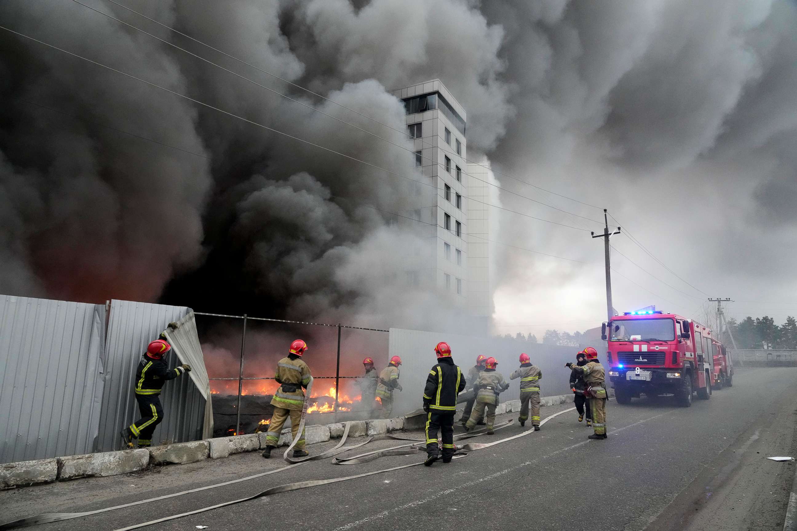 PHOTO: Firefighters work to extinguish a fire at a damaged logistic center after shelling in Kyiv, Ukraine, March 3, 2022. 