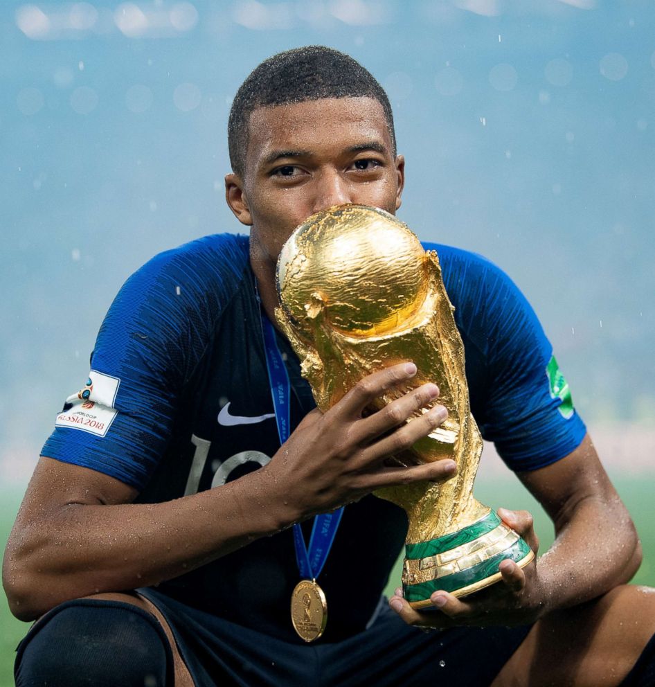 PHOTO: Kylian Mbappe of France celebrates with the World Cup Trophy after winning the 2018 FIFA World Cup final against Croatia at Luzhniki Stadium, July 15, 2018, in Moscow, Russia.