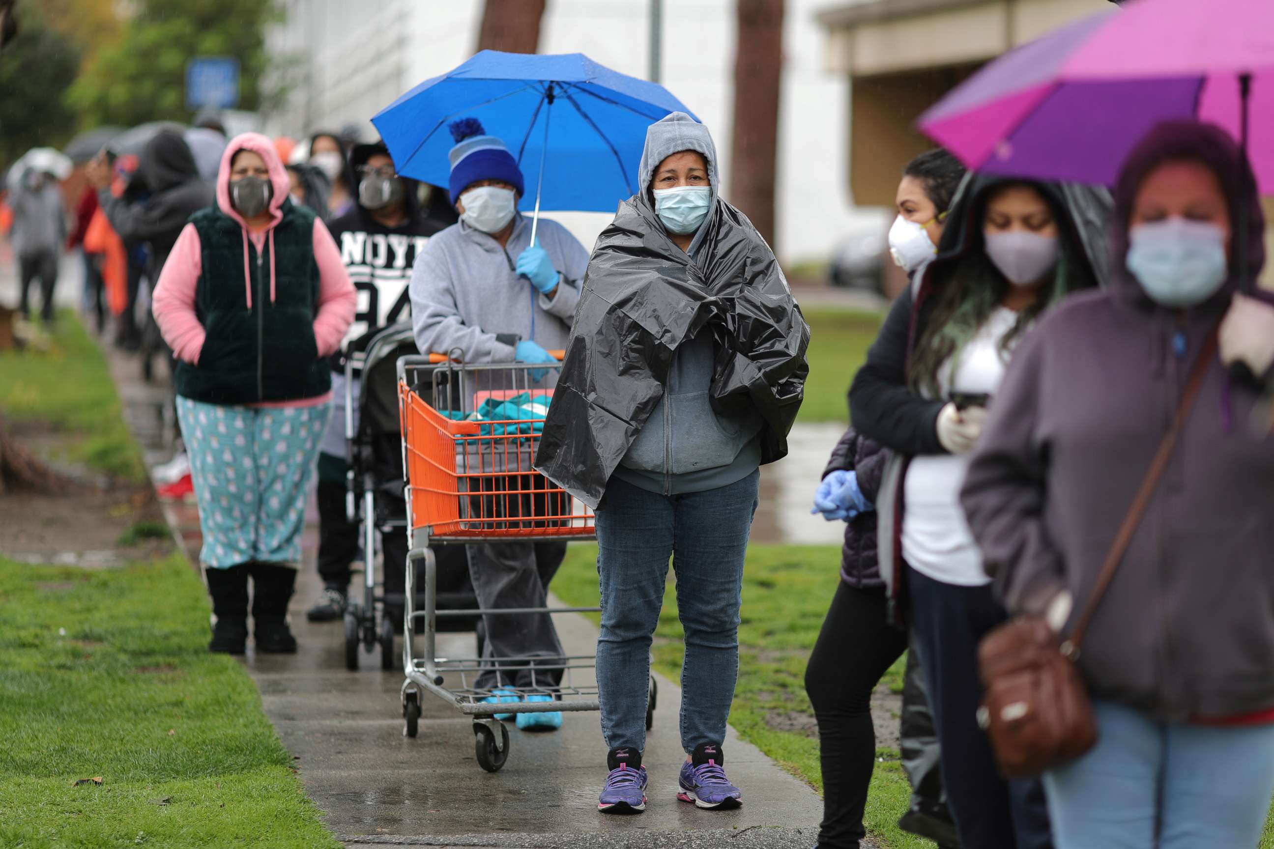 PHOTO: People queue to pick up fresh food at a Los Angeles Regional Food Bank giveaway of 2,000 boxes of groceries, as the spread of the coronavirus disease (COVID-19) continues, in Los Angeles, April 9, 2020.