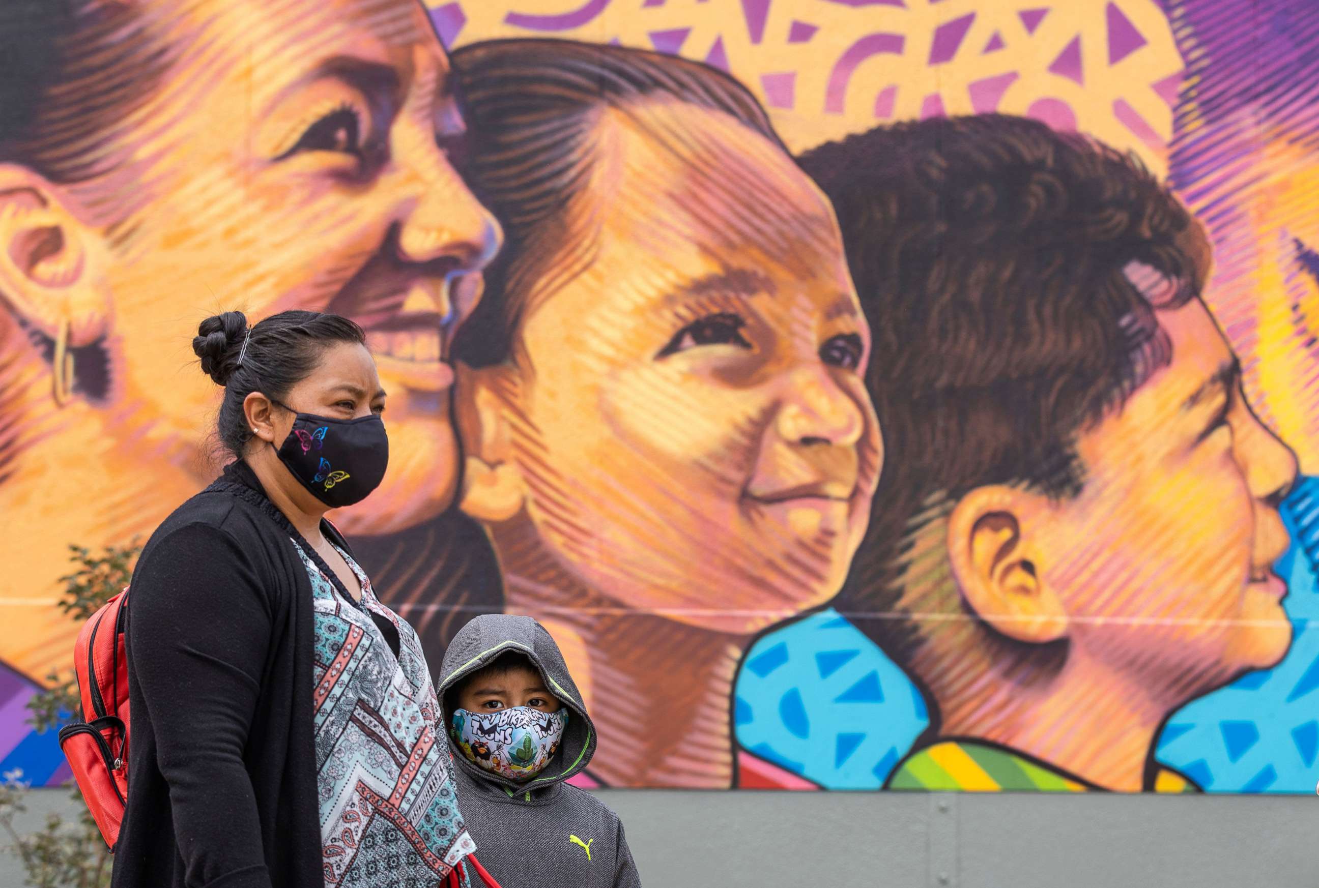 PHOTO: First grade student Daniel Cano, 5, and his mom, Sonia Cano, listen to doctors talk about COVID-19 safety precautions/social distancing and hand washing protocols at a L.A. Unified at Euclid Avenue Elementary School, July 26, 2021, in Los Angeles.