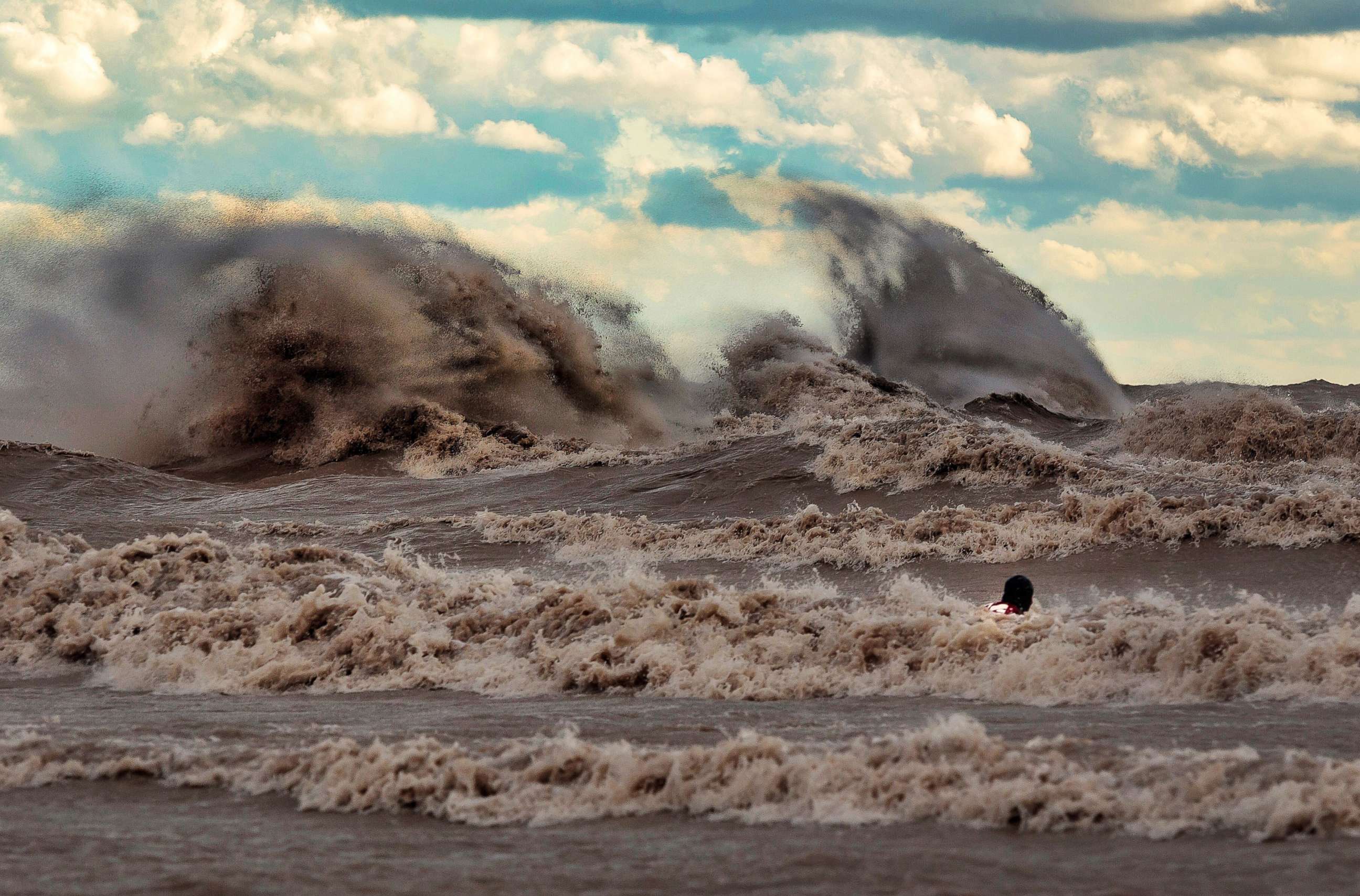 PHOTO: Dave Sandford photographing waves in Lake Erie.