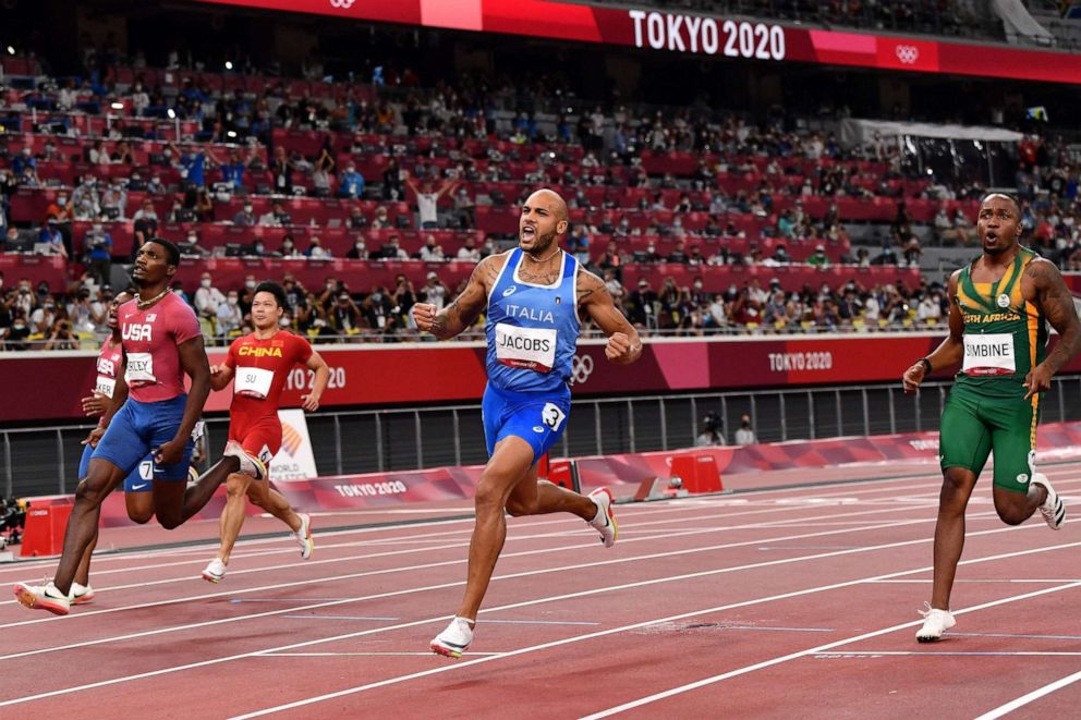 PHOTO: Italy's Lamont Marcell Jacobs celebrates as he crosses the finish line to win the men's 100m final during the Tokyo 2020 Olympic Games at the Olympic Stadium in Tokyo on Aug. 1, 2021.