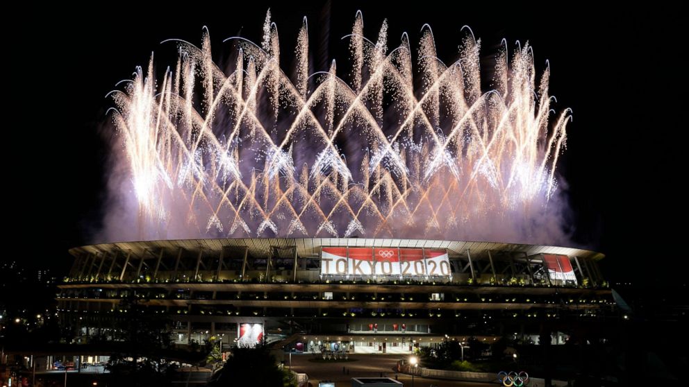 PHOTO: Fireworks illuminate over the National Stadium during the opening ceremony of the 2020 Summer Olympics, Friday, July 23, 2021, in Tokyo.