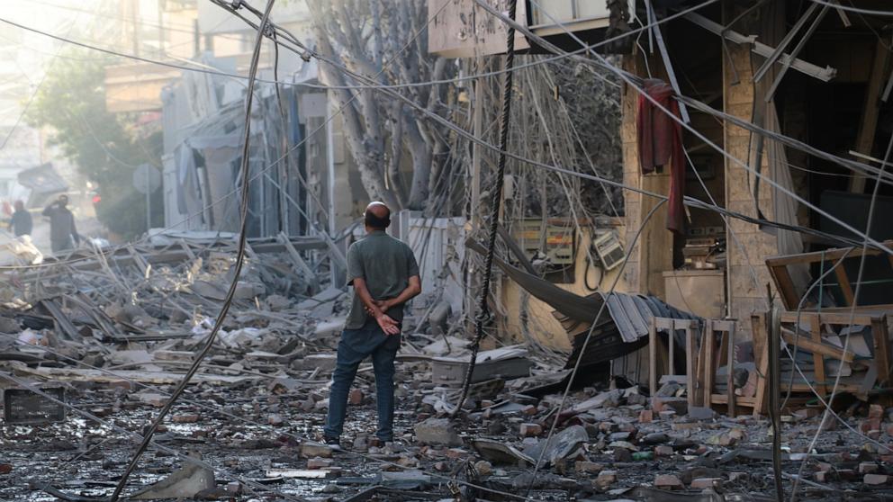 PHOTO: A man checks the site of destroyed buildings that were hit in Israeli airstrikes in the southern port city of Tyre, Lebanon, May 28, 2026.