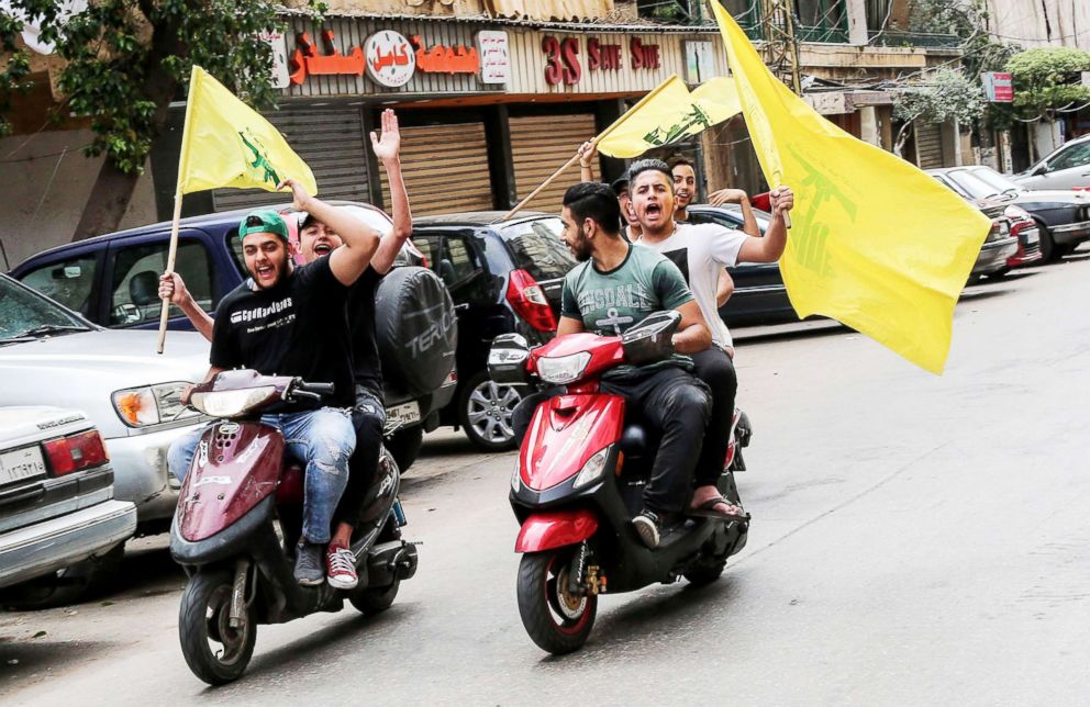 PHOTO: Supporter of Hezbollah carry their party flags and ride motorcycles at the southern suburb of Beirut, Lebanon, May 06, 2018.