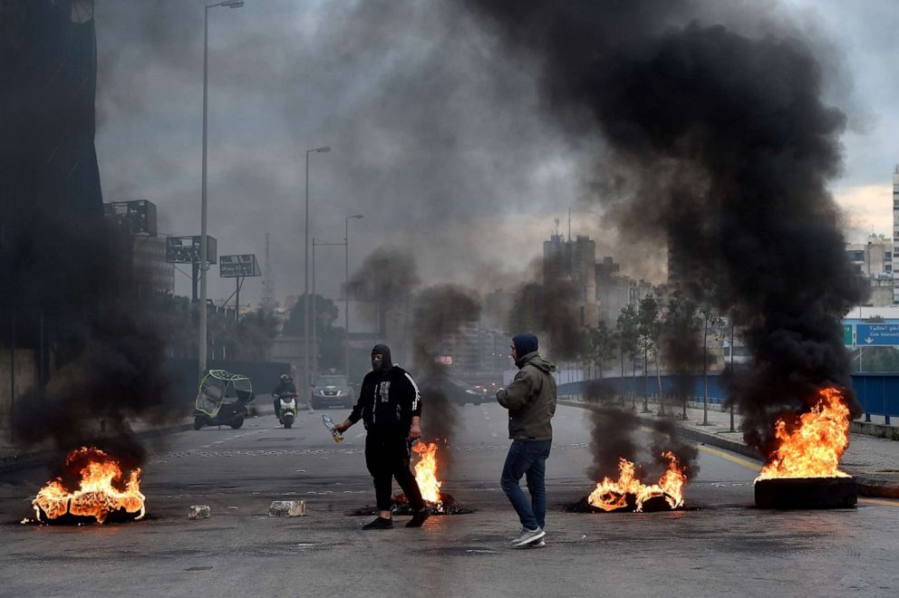 PHOTO: Anti-government protesters burn trash and tires to block roads during a protest against the new government in Beirut, Jan. 22 2020. 