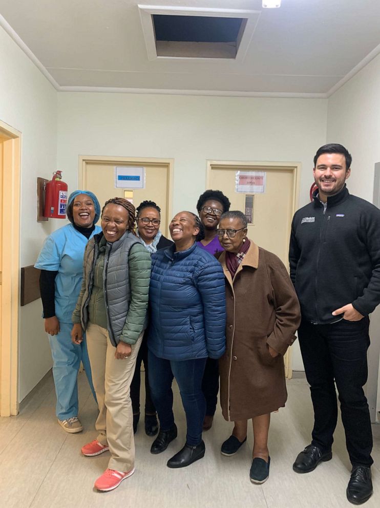 PHOTO: Dr. Kabelo Mputsoe (front left, in green) and Alejandro Nava (right) with other Senkatana Oncology Clinic staff in Lesotho, South Africa.