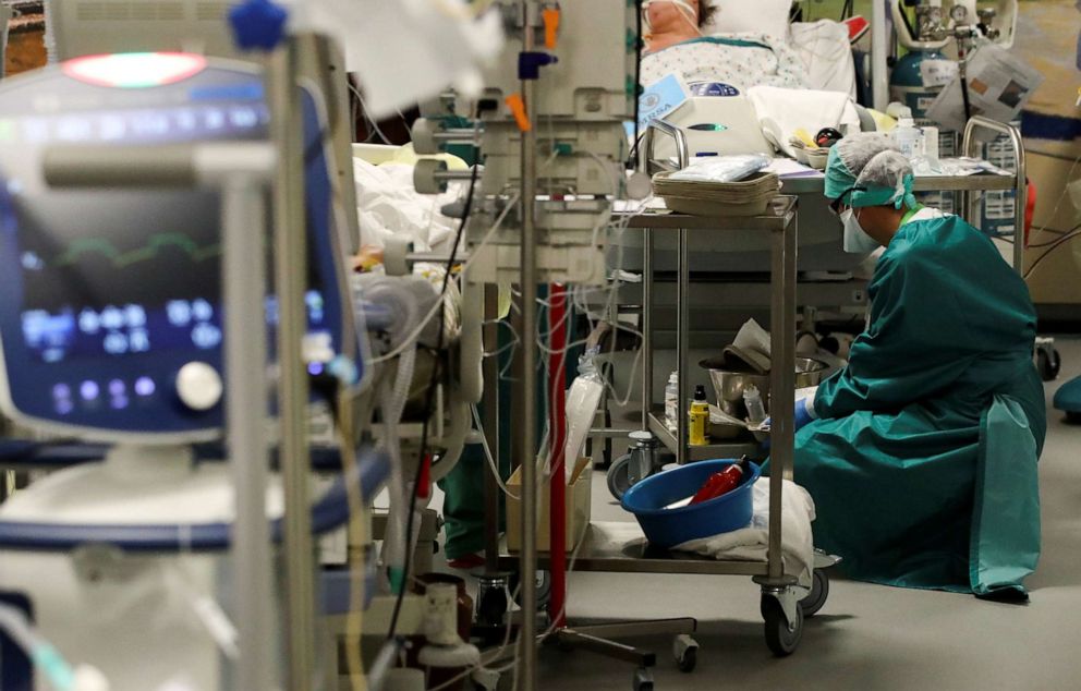 PHOTO: A health worker picks up utensils in a recovery room of an operating theatre transformed for patients suffering the coronavirus disease, at Montlegia CHC clinic in Liege, Belgium, Oct. 29, 2020.