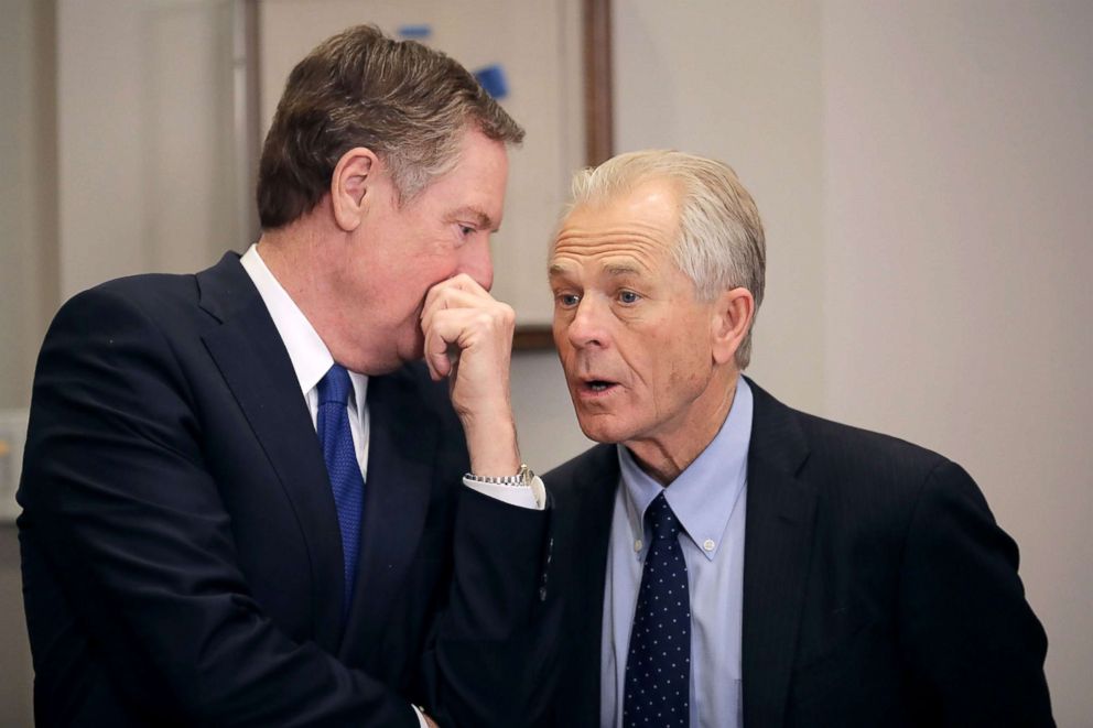 PHOTO: Trade Representative Robert Lighthizer, left, and White House National Trade Council Director Peter Navarro talk, March 8, 2018, at the White House in Washington.