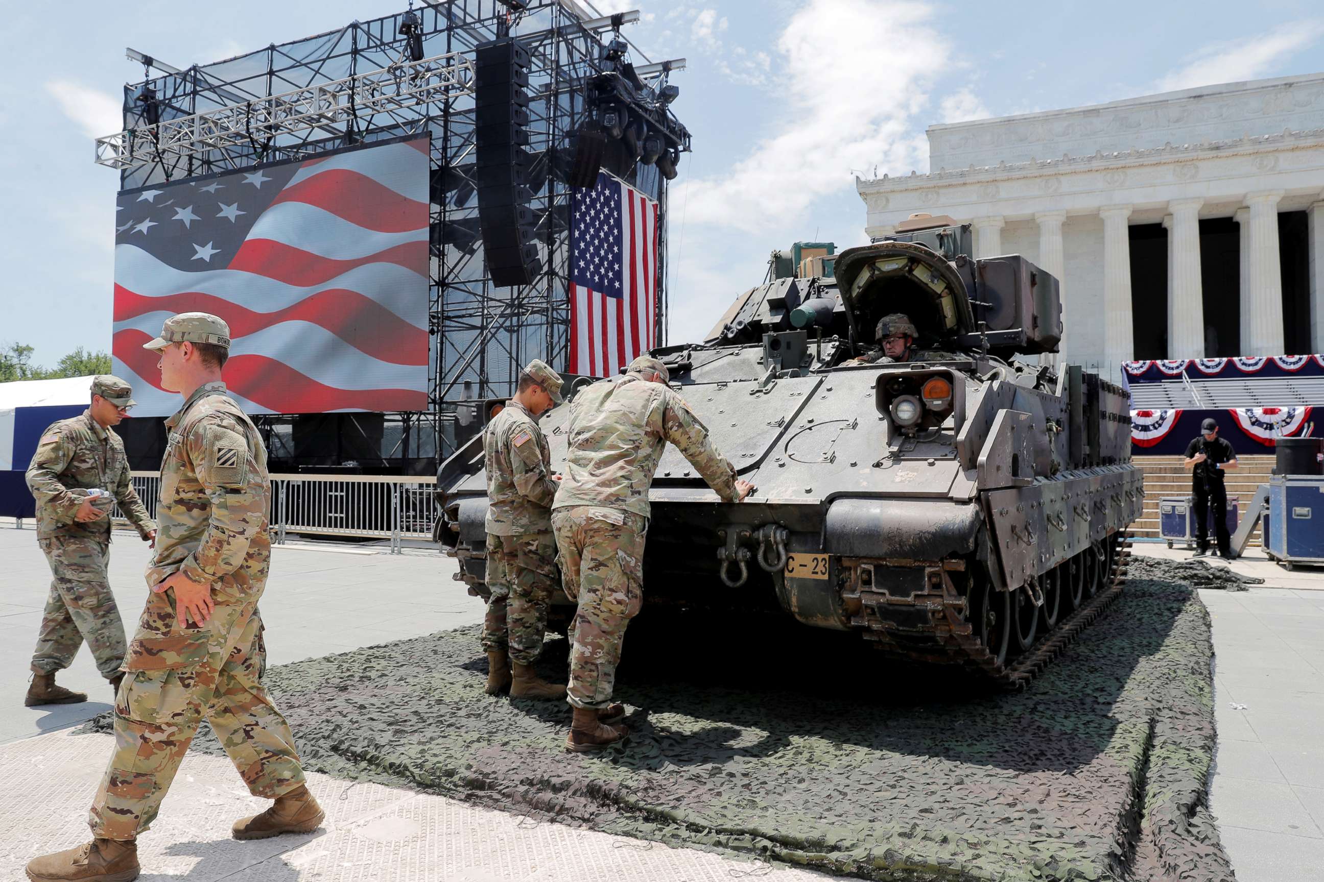 PHOTO: Members of the U.S. Army's 3rd Infantry Division, 1st Battalion, 64th Armored Regiment based at Fort Stewart, Ga., assist as a Bradley Fighting Vehicle is moved into place ahead of a July Fourth celebration in Washington, July 3, 2019.