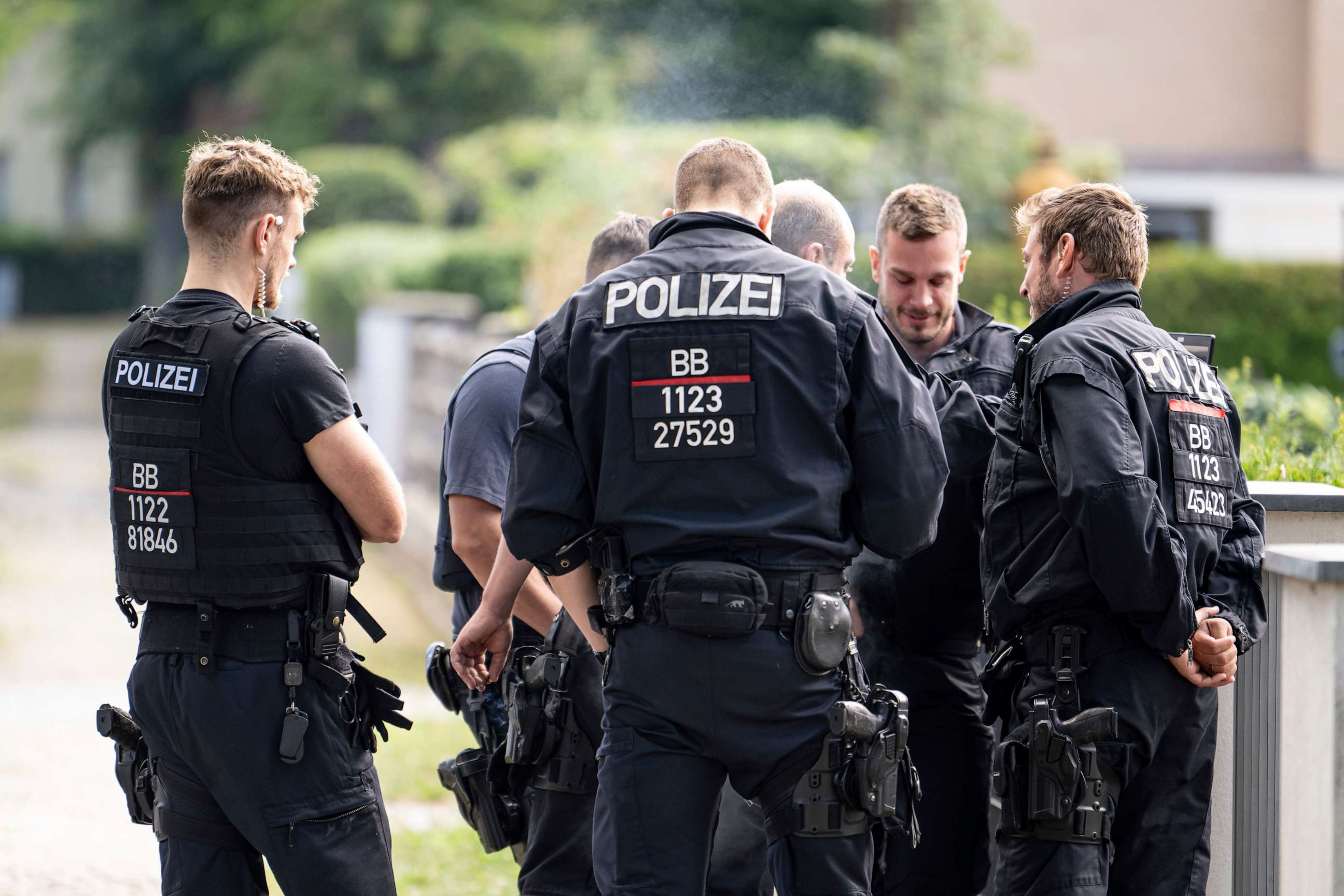 PHOTO: Police officers coordinate the search for a wild animal in a residential area in Teltow, Germany, Thursday July 20, 2023.