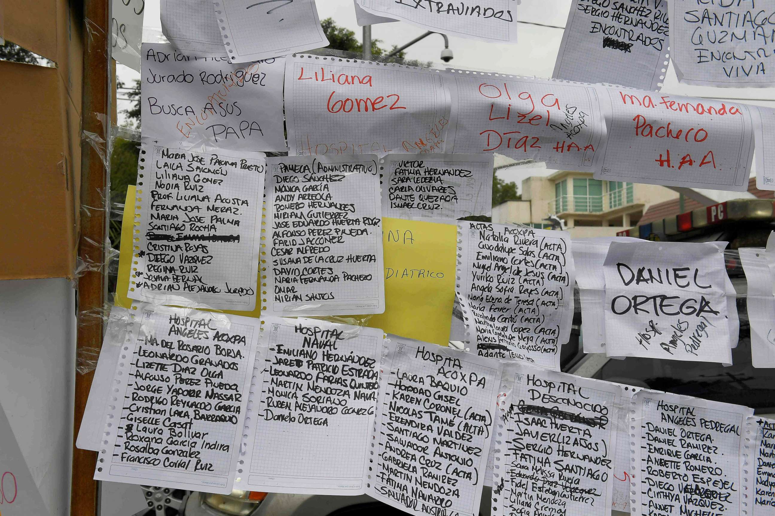 PHOTO: Sheets of paper display names and lists of people and the hospitals they are in, near a school where at least 21 children died and 30 are missing in Mexico City on Sept. 20, 2017.