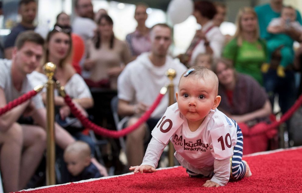 PHOTO: A baby crawls during the Baby Race event to mark international Children's Day in Vilnius, Lithuania, June 1, 2019.