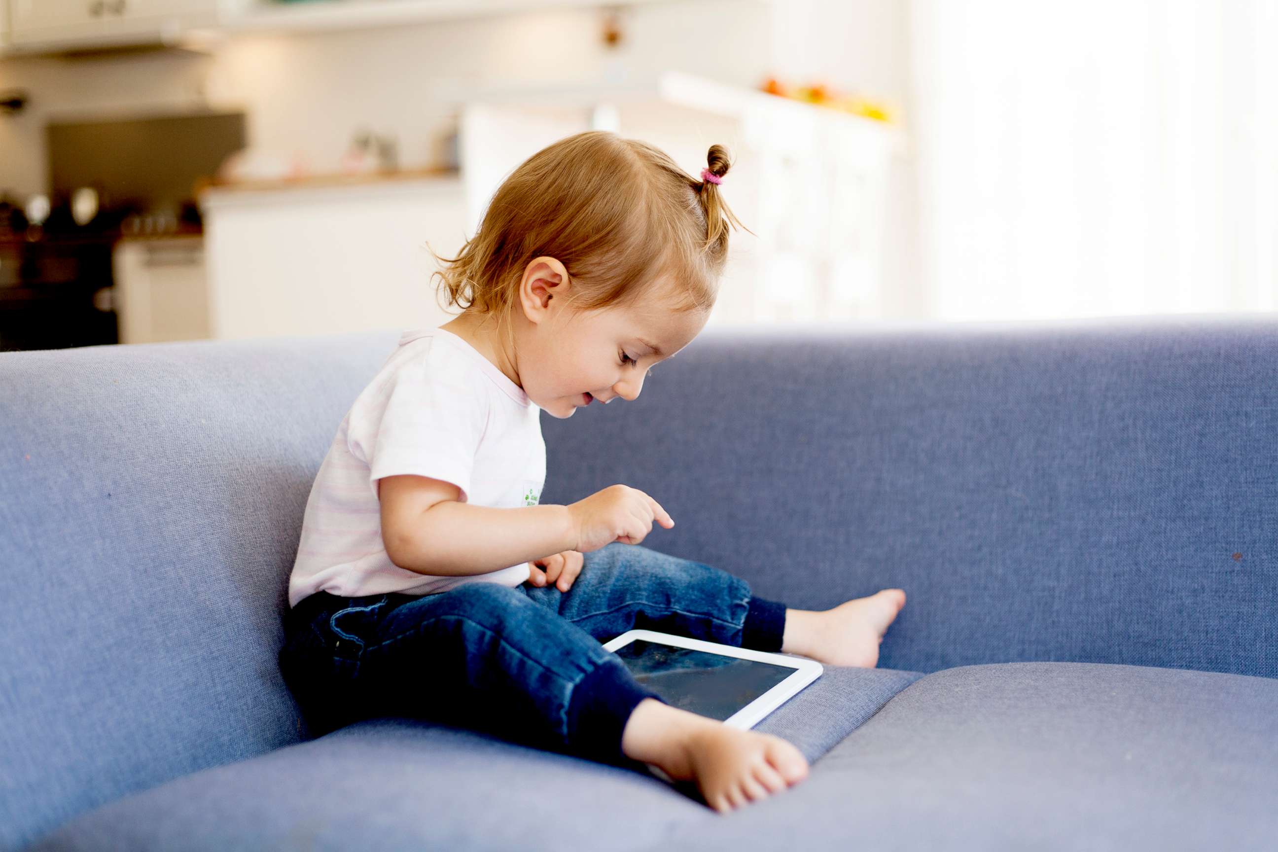 PHOTO: A young girl uses a tablet in an undated stock photo.