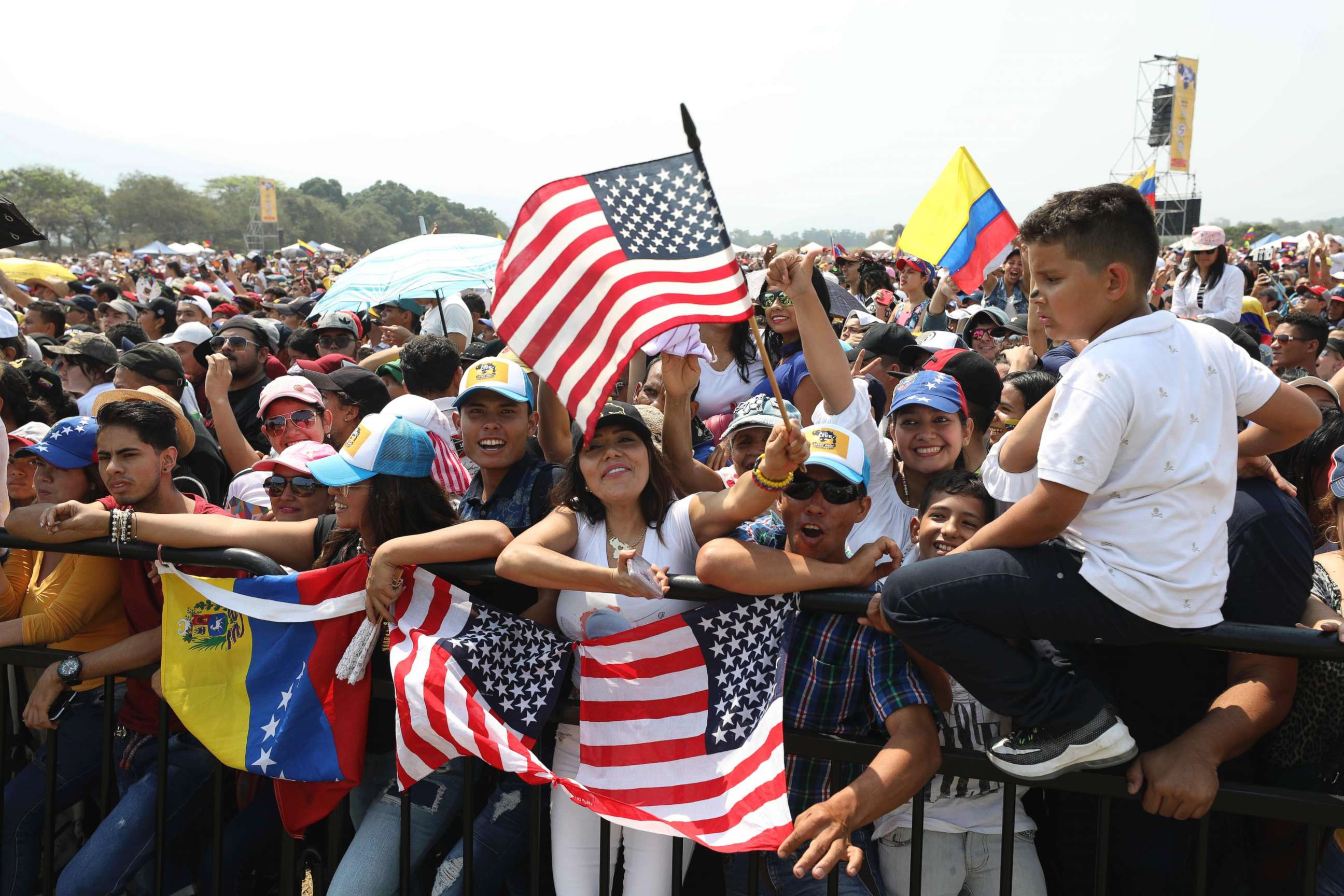 PHOTO: Fans wave Venezuelan and United States flags during the Venezuela Aid Live concert on the Colombian side of the Tienditas International Bridge near Cucuta, Colombia, Feb. 22, 2019.