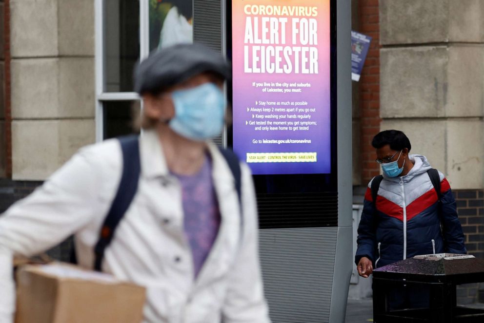 PHOTO: An alert message from the U.K. National Health Service is seen on a street in Leicester, England, on July 1, 2020, after the British government imposed a local lockdown on the city due to rising coronavirus infections.
