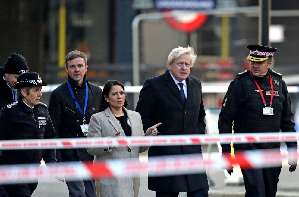 PHOTO: Britain's Prime Minister Boris Johnson, second right, Home Secretary Priti Patel, center, and Metropolitan Police Commissioner, Cressida Dick, left, attend the scene in central London, Saturday, Nov. 30, 2019.