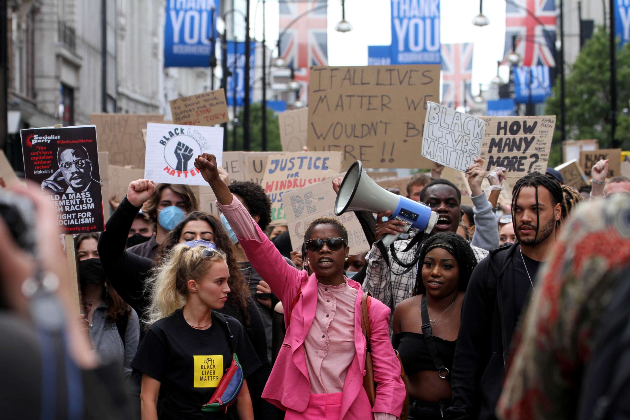 PHOTO: Black Lives Matter demonstrators march through Oxford Street during a protest, June 21, 2020, in London.