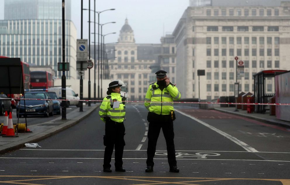 PHOTO: Police officers stand behind the cordon at the scene of a stabbing near London Bridge, in which two people were killed, in London, England, November 30, 2019.