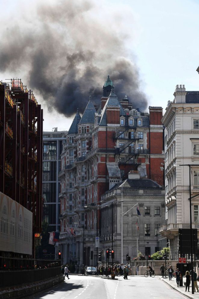 PHOTO: Smoke rises from a building in Knightsbridge, central London, as London Fire Brigade responded to a call of a fire in this upmarket location, June 6, 2018.