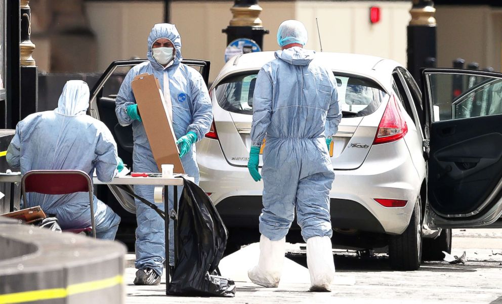 PHOTO: Police forensics officers work around a silver Ford Fiesta car that was driven into a barrier at the Houses of Parliament in central London, Aug. 14, 2018.