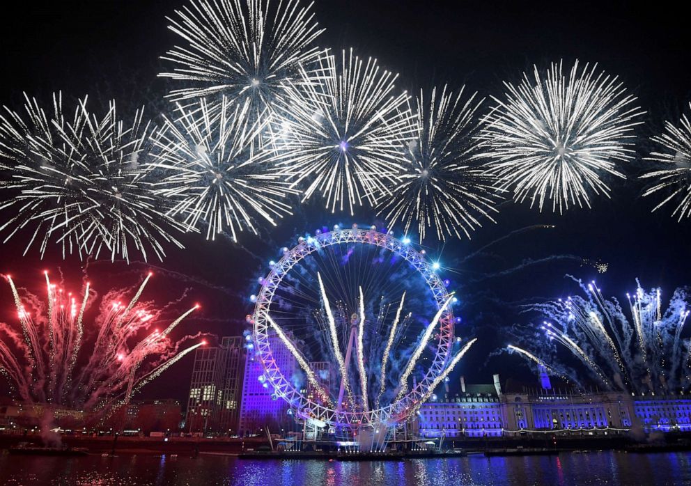PHOTO: Fireworks explode around the London Eye wheel during New Year celebrations in central London, Britain, January 1, 2020. 