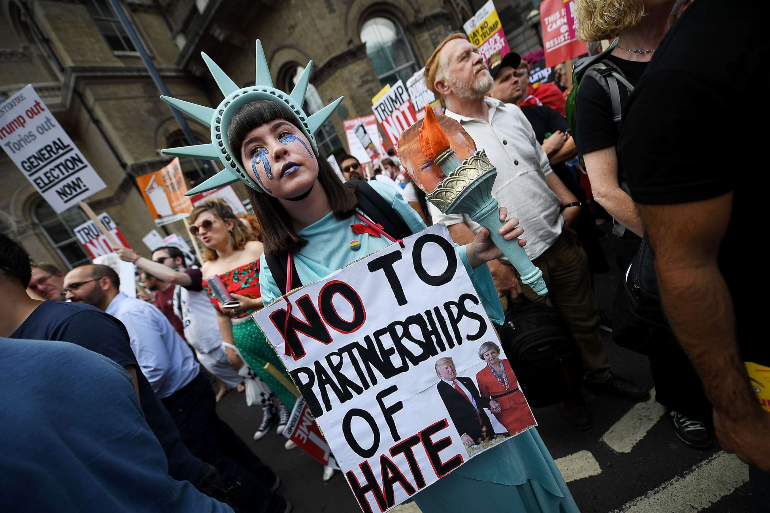 PHOTO: A protester takes part in a demonstration against President Trump's visit to the U.K., near Portland Place on July 13, 2018 in London.