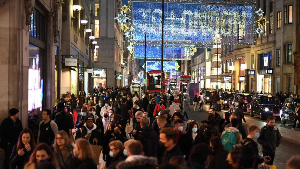 PHOTO: Christmas illuminations are seen above shoppers on Regent Street in the main high-street shopping area of London, Dec. 15, 2020 ahead of fresh measures for the capital amid rising novel coronavirus infection rates.