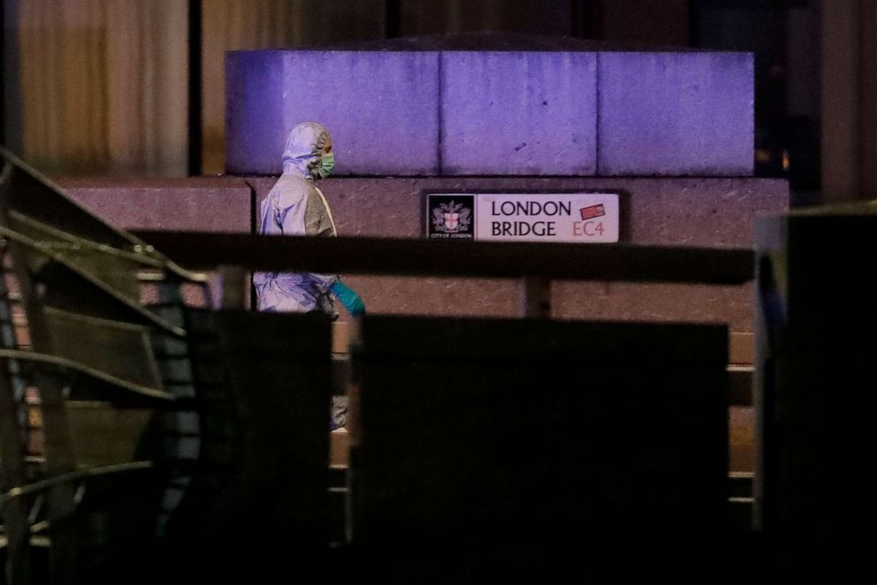 PHOTO: A police forensic officer walks by a sign on London Bridge following an incident in London, Nov. 29, 2019.