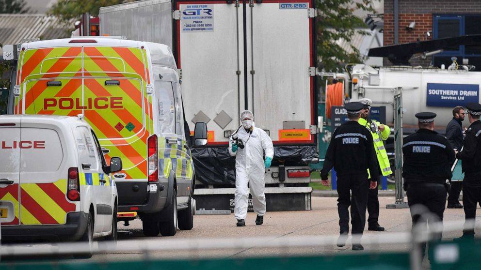PHOTO: British Police officers in forsensic suits work near a lorry, found to be containing 39 dead bodies, inside a police cordon at Waterglade Industrial Park in Grays, east of London, on Oct. 23, 2019.